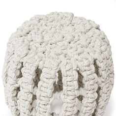 a white crocheted ball sitting on top of a table