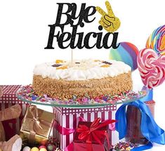 there is a cake with the word be felica on it next to other items