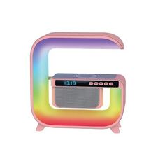 the colorful radio is sitting on top of it's stand and has an alarm clock