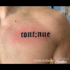 the word contrue written in cursive ink on a man's chest