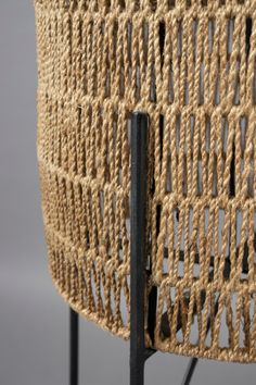 a close up of a chair with rope on it