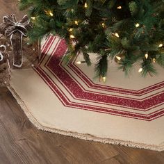 a christmas tree skirt is on the floor