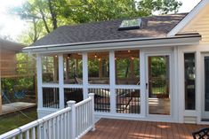 the back porch is covered with glass doors