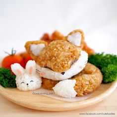 some kind of food on a plate with carrots and broccoli