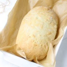 a loaf of bread sitting in a white container