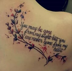 a woman's back with a tattoo saying you may be gone from my sight but you are never gone from my heart