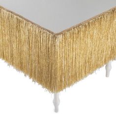 an image of a table with fringe on it