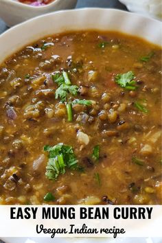 A bowl of mung bean curry garnished with chopped cilantro Mung Bean Recipes, Mung Bean Curry, Kashmiri Recipes, Moong Dal Recipe, Bean Curry, Curry Recipes Easy, Curry Night, Vegan Indian Recipes, Beans Curry