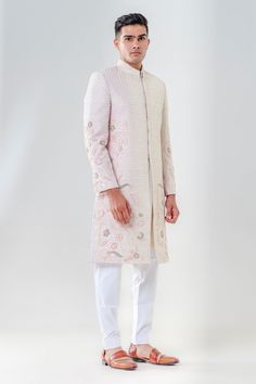 Salmon pink sherwani featuring delicately embroidered cut dana floral motifs highlighted by threadwork. Comes with a kurta and pant.
Components: 3
Pattern: Embroidered
Type Of Work: Cut dana, Threadwork
Neckline: Mandarin Collar
Sleeve Type: Full
Fabric: Raw Silk
Color: Pink
Other Details: 
Hook button closure
Welt pocket
French knot embroidered motifs
Occasion: Groom,Wedding - Aza Fashions Pink Bandhgala With Chikankari Embroidery For Eid, Pink Sherwani With Dabka Work For Eid, Traditional Pink Bandhgala With Chikankari Embroidery, Pink Dabka Work Sherwani For Eid, Fitted Pink Sherwani With Chikankari Embroidery, Pink Fitted Sherwani With Chikankari Embroidery, Elegant Pink Sherwani With Resham Embroidery, Elegant Pink Sherwani With Intricate Embroidery, Elegant Pink Sherwani With Dabka Detailing