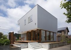 a modern house with stairs leading up to it