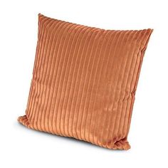 an orange velvet pillow on a white background