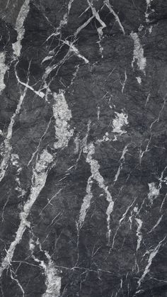 black and white marble textured wallpaper with silver veining on the top right corner