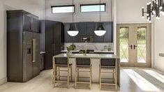 an open concept kitchen and dining room with wood flooring, black cabinetry and stainless steel appliances