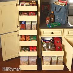 an open cabinet in the middle of a kitchen filled with spices and condiments