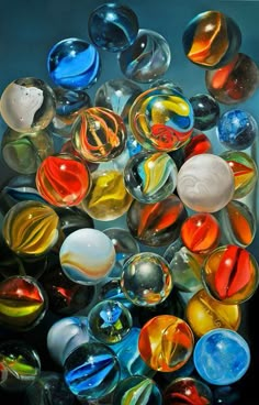 many different colored glass marbles are shown in this image, and there is no image here to provide a caption for