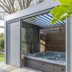 an outdoor jacuzzi is shown in the backyard