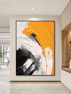 an abstract painting hangs on the wall in a modern living room with white and yellow accents