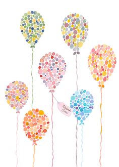 four balloons with confetti on them are hanging from the string in different colors