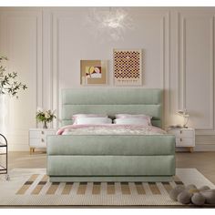 a bedroom with a bed, nightstands and pictures on the wall above it in pastel colors