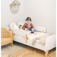 "A sturdy bed built just for toddlers with playful curves and modern shapes to smooth the meaningful transition into “a real bed.” The low profile and two removable rails provide a safe and comfortable sleeping place that helps your active toddler easily get in and out of bed. This high-quality bed fits a standard crib mattress and brightens any decor with a pop of modern design. " dadada Bed Frame Color: White/Natural | dadada Muse 19.49 H x 31.0 W x 55.0 D in white / brown in White / Natural | Modern Toddler Bed, Nursing Pillows, Toddler Beds, Modern Shapes, High Quality Bedding, Crib Mattress, Toddler Room, Baby Safe, Quality Bedding