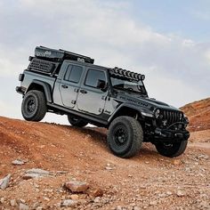 the jeep is parked on top of a hill with no wheels or tires, and it's all off road ready to go