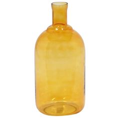 a yellow glass bottle sitting on top of a table