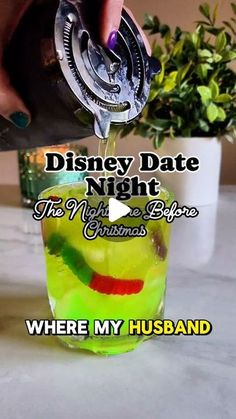 someone is pouring something into a glass with the words disney date night, this might be christmas