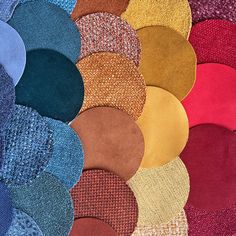 many different colors of fabric are arranged in the shape of circles on top of each other