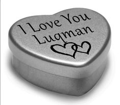 a heart shaped tin box with the words i love you, juand on it