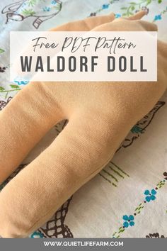 a stuffed doll with the words free pattern waldorf doll on it's back