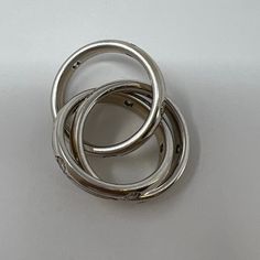 three silver rings sitting on top of each other