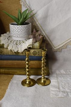 Vintage Pair of Brass Barley Twist Candle Holders / Antique Heavy Brass Gold Candle Stick Holders / Made in England Pretty pair of small barley twist brass candle holders. Warm up a room with this pair of matching brass candle stick holders or add to a collection. In good vintage condition. Marked made in England. Measures Approx.   This is a vintage item , sold as is with its original charm and patina. Gold Candle Stick, Gold Candle Stick Holders, Brass Candle Stick, Twist Candle, Gold Candle Sticks, Candle Stick Holders, Gold Candle, Barley Twist, Gold Candles