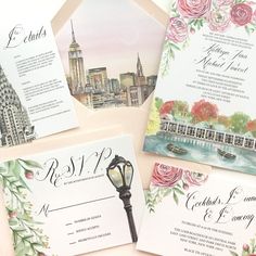 the wedding stationery is laid out on top of each other, including an umbrella and flowers