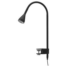 an image of a black lamp on a white background with clippings to the side