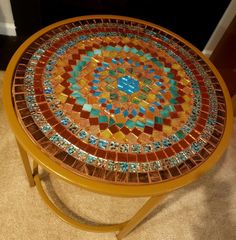 a table with a colorful mosaic design on it