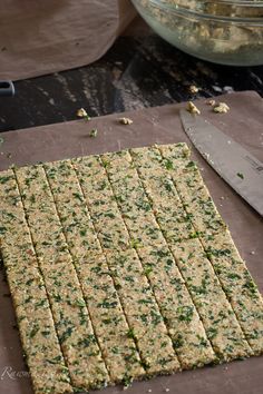 the crackers are cut up and ready to be cooked in the oven with a knife