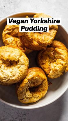 a white bowl filled with pastries on top of a table