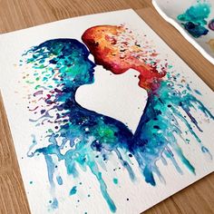 a watercolor painting of a woman's face with paint splatters on it