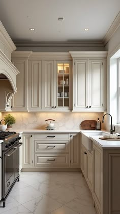 a large kitchen with white cabinets and marble counter tops on the counters is pictured in this image