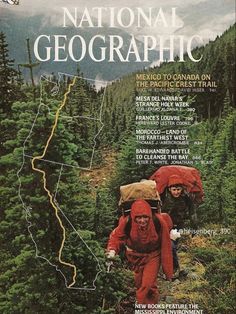 the cover of national geographic magazine shows two hikers hiking up a mountain