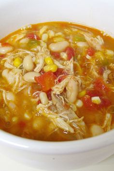 a white bowl filled with soup on top of a table