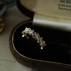 a close up of a ring in a box