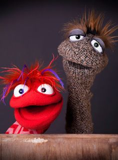 the sesame street characters are posed next to each other