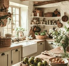 a kitchen filled with lots of counter top space next to a sink and stove top oven