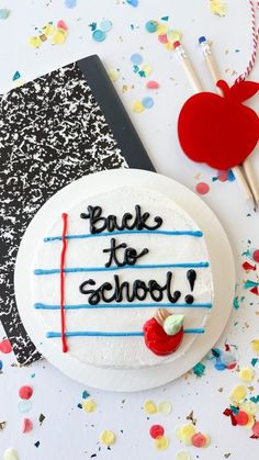 a back to school cake sitting on top of a table