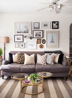 a living room filled with lots of furniture and pillows on top of it's couches