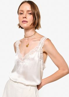 V-neckline, featuring sheer embroidery edge lace, which continues up the straps Bra-friendly Slits at side seam Unlined Feminine V-neck Delicate Lace Top, Elegant V-neck Tank Top With Lace Trim, Elegant V-neck Camisole With Lace Trim, Scalloped Lace Sleeveless Camisole, Wedding V-neck Camisole With Delicate Straps, Elegant Sleeveless Camisole With Contrast Lace, Feminine Lace V-neck Camisole, Delicate Lace Trim Sleeveless Camisole, Chic Lace Camisole With Contrast Lace