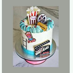 a birthday cake with movie themed decorations on it