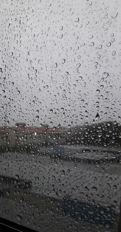 rain drops on the window as it is raining