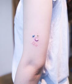 a person with a small tattoo on their arm